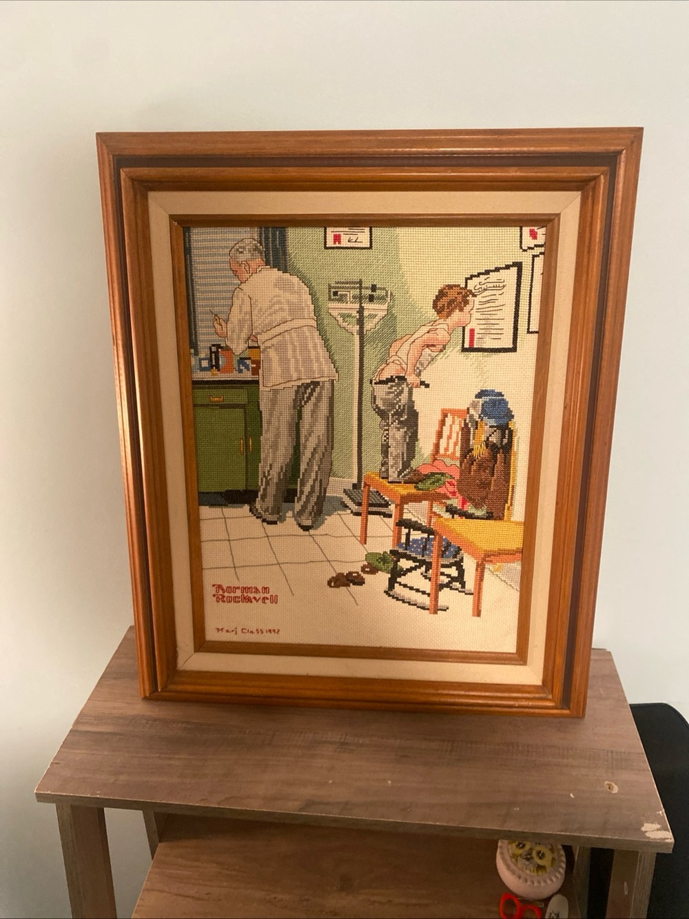 VTG Hand Cross-Stitched Norman Rockwell “At The Doctors” Framed Wall Art 15x18